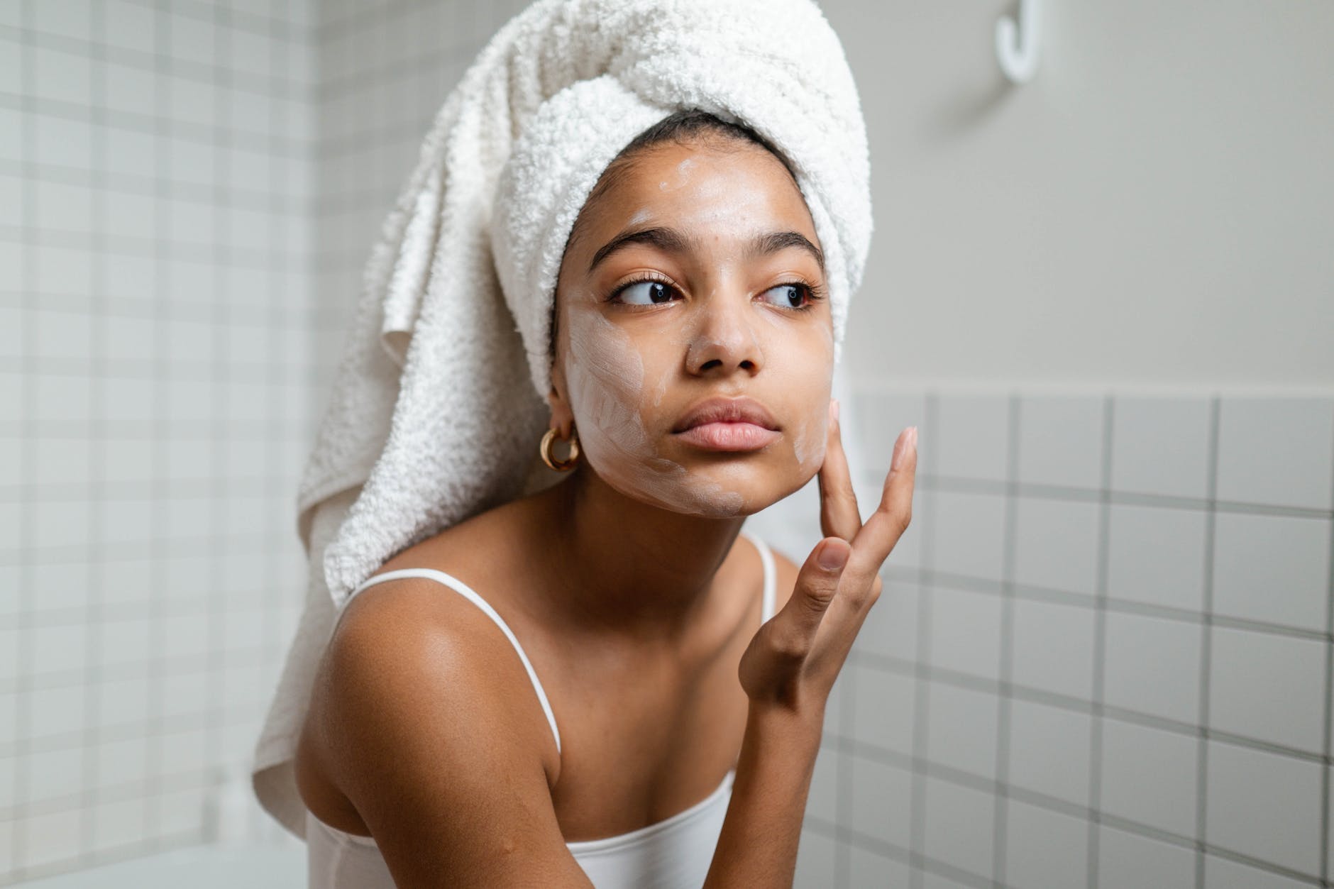 woman applying face cream